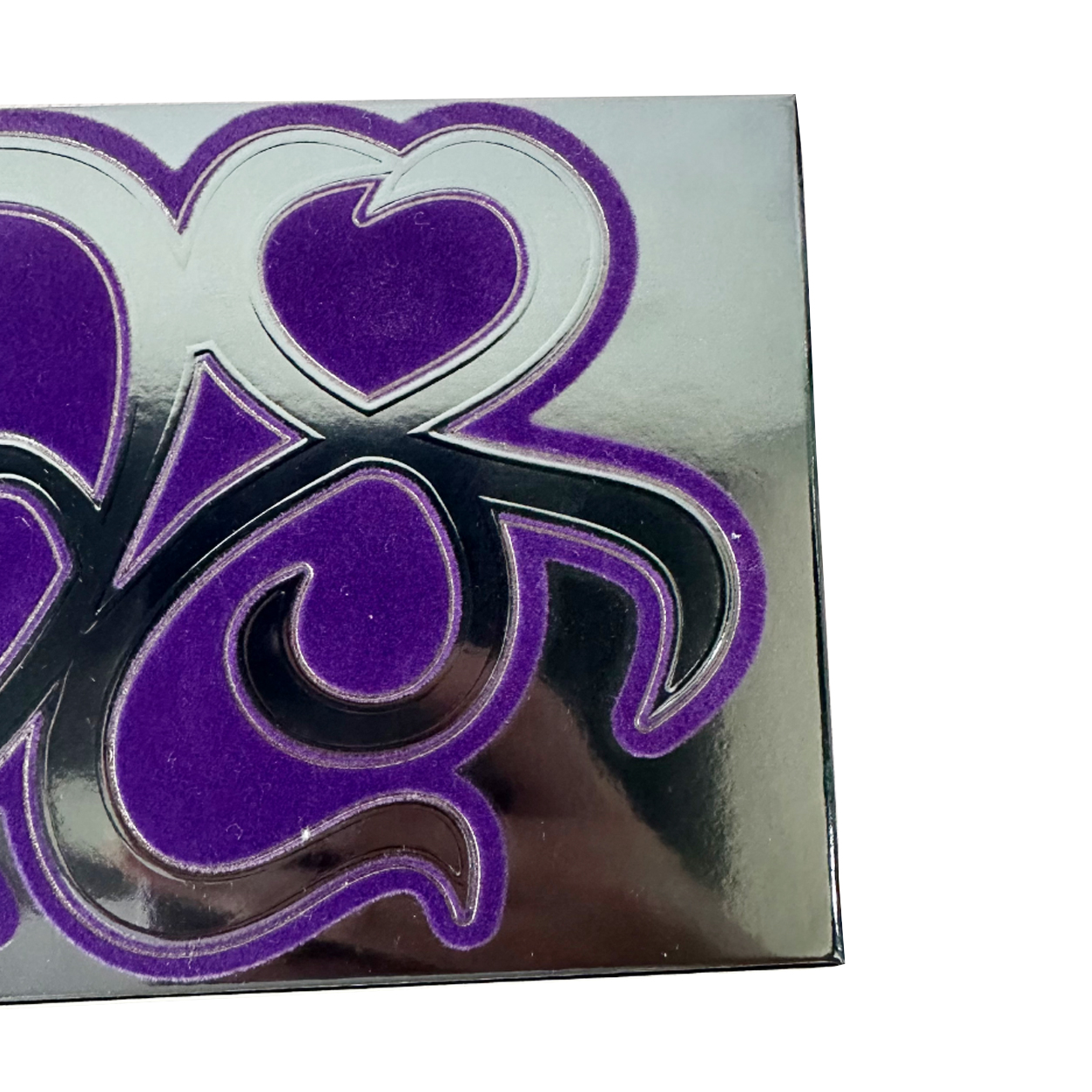Close-up of spot flocking on custom silver card paper folding carton