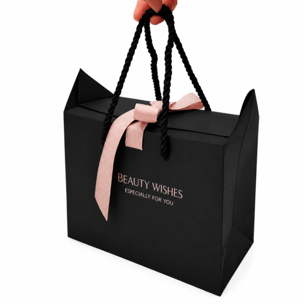 Custom luxury black paper gift bags with gold foil logo and ribbon closure