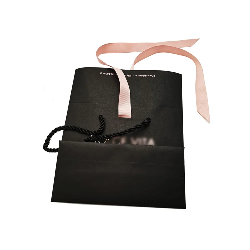 Luxury paper gift bag with ribbon closure and decorative bow design