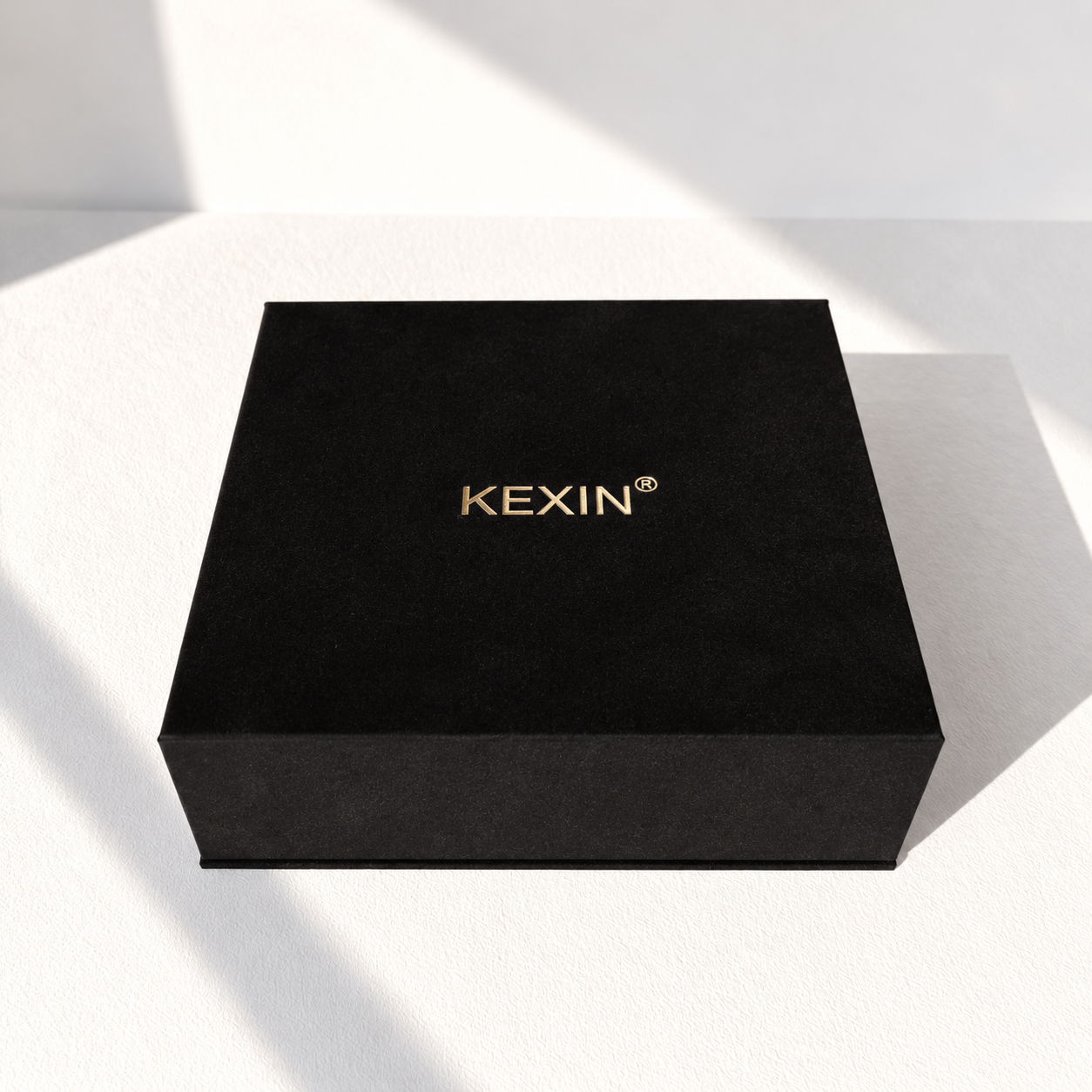 Luxury black velvet gift box with gold foil logo